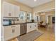 Modern kitchen with white cabinets, stainless steel appliances, and view to dining room at 125 W Noble St, Lebanon, IN 46052