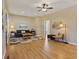Bright living room with neutral tones, ceiling fan, and hardwood flooring at 125 W Noble St, Lebanon, IN 46052