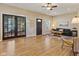 Bright living room with wood floors, ceiling fan, and decorative french doors at 125 W Noble St, Lebanon, IN 46052