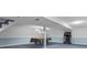 Basement area featuring blue carpet, pool table, exposed ceiling, and exercise equipment at 12867 Andover Dr, Carmel, IN 46033