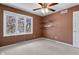 Bedroom featuring a window that looks outside, floating shelves, and carpeted floor at 12867 Andover Dr, Carmel, IN 46033