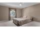Bedroom featuring a cozy queen bed, neutral carpet, crown molding, and a sunlit window at 12867 Andover Dr, Carmel, IN 46033