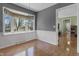 Bright dining area with large windows and natural light; featuring warm wood flooring at 12867 Andover Dr, Carmel, IN 46033