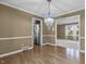 Elegant dining room featuring a modern chandelier and seamless access to other living areas at 12867 Andover Dr, Carmel, IN 46033