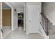 Entryway features tile flooring, staircase, and an open view to other rooms in the home at 12867 Andover Dr, Carmel, IN 46033
