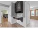 Hallway featuring a built-in desk with stone countertops and convenient storage at 12867 Andover Dr, Carmel, IN 46033