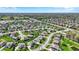 Expansive aerial view of a residential community with ponds and lush greenery at 13836 Fieldcrest Dr, McCordsville, IN 46055