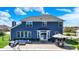 Expansive backyard with a pool, patio area with lounge seating, and lush green surroundings at 13836 Fieldcrest Dr, McCordsville, IN 46055