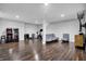Finished basement featuring a sitting area, game area, and dark-stained flooring at 13836 Fieldcrest Dr, McCordsville, IN 46055