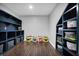 Basement featuring built-in storage and stylish stained flooring at 13836 Fieldcrest Dr, McCordsville, IN 46055