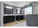 Bathroom features dual vanities with marble countertops and modern fixtures at 13836 Fieldcrest Dr, McCordsville, IN 46055