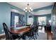 Elegant dining room featuring a chandelier and a view into the living room and front entry at 13836 Fieldcrest Dr, McCordsville, IN 46055