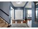 Elegant entryway with hardwood floors, stylish rug, and a welcoming ambiance at 13836 Fieldcrest Dr, McCordsville, IN 46055