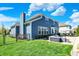 A beautifully landscaped backyard features a spacious patio with a firepit and a barbecue, ideal for gatherings at 13836 Fieldcrest Dr, McCordsville, IN 46055