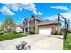 Charming two-story home with manicured landscaping, attached garage and basketball hoop at 13836 Fieldcrest Dr, McCordsville, IN 46055