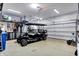Well-organized garage featuring a golf cart and storage units at 13836 Fieldcrest Dr, McCordsville, IN 46055