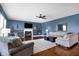 Spacious living room with fireplace, built-in shelving, and comfortable seating at 13836 Fieldcrest Dr, McCordsville, IN 46055