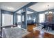 Open-concept living room featuring hardwood floors, a dining area, and lots of natural light at 13836 Fieldcrest Dr, McCordsville, IN 46055