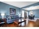 Cozy living room with comfortable seating, stylish decor, and an open-concept dining area at 13836 Fieldcrest Dr, McCordsville, IN 46055