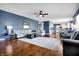 Open living area with an area rug and access to the kitchen and dining spaces at 13836 Fieldcrest Dr, McCordsville, IN 46055