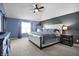 Serene main bedroom with vaulted ceiling, plush carpet, and elegant furniture at 13836 Fieldcrest Dr, McCordsville, IN 46055