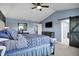 Stylish bedroom featuring a vaulted ceiling, barn door, and contemporary design at 13836 Fieldcrest Dr, McCordsville, IN 46055