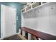 Organized mudroom with bench seating, hooks, and overhead basket storage at 13836 Fieldcrest Dr, McCordsville, IN 46055