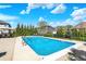 Enjoy the serene in-ground pool with easy access steps and handrails, surrounded by lush landscaping at 13836 Fieldcrest Dr, McCordsville, IN 46055