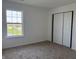 Bright bedroom featuring carpeting, white walls, and a closet at 1539 Egret Ln, Greenwood, IN 46143