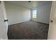 Carpeted bedroom with a window that lets in natural light at 1539 Egret Ln, Greenwood, IN 46143