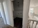 Upstairs hallway, with view of stairs and a storage closet at 1539 Egret Ln, Greenwood, IN 46143