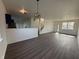 Bright living room with modern wood floors, neutral walls, and an open floor plan at 1539 Egret Ln, Greenwood, IN 46143
