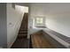 Spacious living area features stairs, hardwood floors, and neutral walls at 1539 Egret Ln, Greenwood, IN 46143