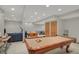 Finished basement with a pool table, foosball table, and ping pong table for entertainment at 16 Cattail Ln, Brownsburg, IN 46112