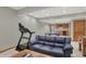 Basement Gathering room including workout equipment, a ping pong table and a wet bar at 16 Cattail Ln, Brownsburg, IN 46112