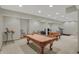 Spacious finished basement with a pool table, foosball, treadmill and comfortable seating area at 16 Cattail Ln, Brownsburg, IN 46112