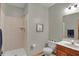 A bathroom featuring a shower, toilet, and sink with modern fixtures at 16 Cattail Ln, Brownsburg, IN 46112