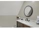 Bathroom with an oval mirror, sink, and storage basket for towels at 16 Cattail Ln, Brownsburg, IN 46112