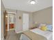 Cozy bedroom featuring carpet floors and a doorway that leads to the bathroom at 16 Cattail Ln, Brownsburg, IN 46112