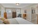 Bedroom featuring neutral colors, carpet flooring, an accent chair, and a bright, airy feel at 16 Cattail Ln, Brownsburg, IN 46112