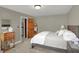 Bedroom with a queen bed, carpet flooring, and a view to an adjacent room at 16 Cattail Ln, Brownsburg, IN 46112