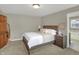 Bedroom features a queen bed, soft carpet and access to an en-suite bathroom with soaker tub at 16 Cattail Ln, Brownsburg, IN 46112