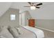 Bedroom featuring a ceiling fan, dresser, and neutral color palette for a soothing ambiance at 16 Cattail Ln, Brownsburg, IN 46112