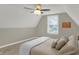 Bedroom featuring soft carpet, window view, and a ceiling fan for comfort at 16 Cattail Ln, Brownsburg, IN 46112