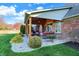 View of the backyard with covered patio area featuring outdoor seating at 16 Cattail Ln, Brownsburg, IN 46112