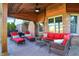 Relaxing covered patio with outdoor furniture, ceiling fan, ideal for enjoying the outdoors at 16 Cattail Ln, Brownsburg, IN 46112