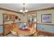 Dining room with chandelier, hardwood floors and hutch at 16 Cattail Ln, Brownsburg, IN 46112