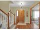 Welcoming foyer with hardwood floors and a staircase at 16 Cattail Ln, Brownsburg, IN 46112