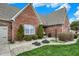Charming single-Gathering home featuring a brick exterior, mature landscaping, and a paved walkway at 16 Cattail Ln, Brownsburg, IN 46112