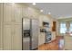 Spacious kitchen features stainless steel appliances, custom cabinets, and hardwood flooring at 16 Cattail Ln, Brownsburg, IN 46112